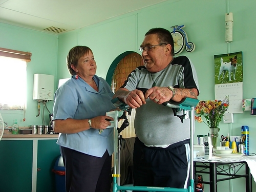 Person with disability and caregiver Person with disability and caregiver
